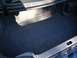 1995 Nissan 240SX - The interior of a car's trunk is shown, gray carpeting and a visible latch mechanism.