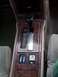 1995 Ford Crown Victoria - Close-up of a car's center console with automatic transmission shifter and wood trim details.