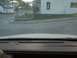 1995 Ford Crown Victoria - The view from the driver's seat shows a street scene with buildings and a stop sign.