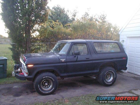 Black Ford Bronco parked in driveway next to a garage. It has BFGoodrich tires and a winch on the front bumper