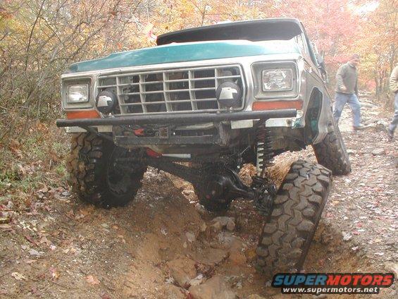 1979 Ford Bronco II on a muddy trail, front wheels turned