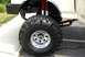 1991 Ford F-250 - Close-up of the front wheel and suspension of a lifted 1991 Ford F-250.