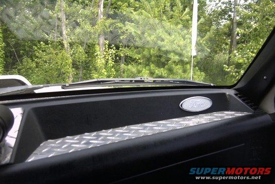 Interior view of 1991 Ford F-250 dashboard with Ford emblem and diamond plate trim