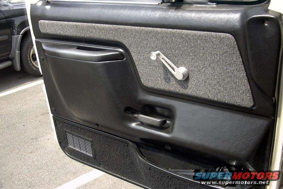 1991 Ford F-250 interior door panel with fabric insert and manual window crank
