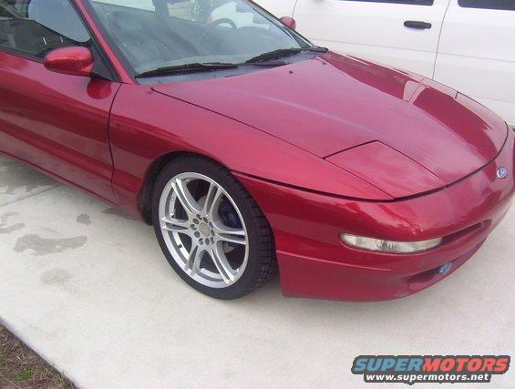 Red 1997 Ford Probe front quarter view, showing the hood, fender, and wheel
