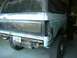 1984 Ford Bronco - This 1984 Ford Bronco is in the process of restoration, showing its rear quarter panel with a primer finish and a visible license plate.