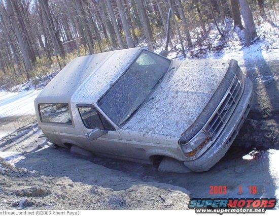 1993 Ford Bronco stuck in mud, 3q-front view