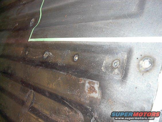 im002131.jpg By drilling holes in the floor you are able to button weld the box's flanges to the floor from above instead of having to weld upside down.  Seal sealer makes sure none of the edges underneath leak. 