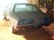 1977 Ford Mustang II - July 16-04. Half of the car sanded to bare metal and primered.