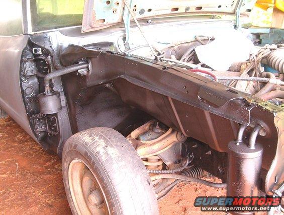 im001212.jpg Fenderwells completed. Found 2 rust spots about a pea size each. Rust spots were treated with a rust converter. 
De-greased, stripped, painted and 2 coats of undercoating.