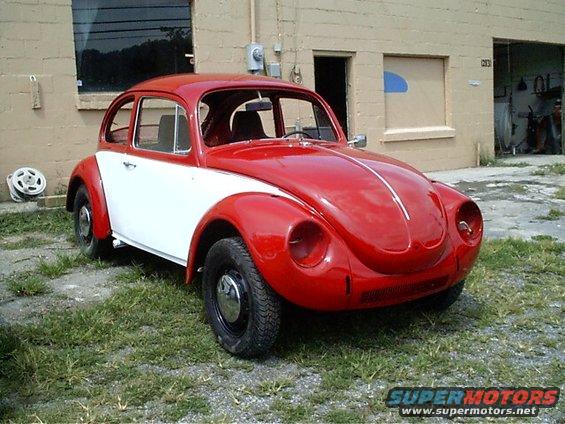 bug-done.jpg Finished! The owner installed the interior, bumpers, headlights...etc at his own request.