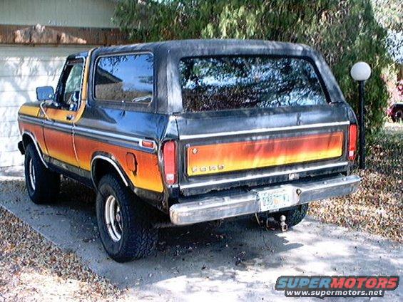 1979 Ford Bronco rear view with orange and yellow stripe