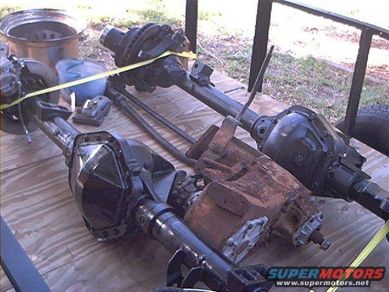Axles and transmission parts on a wooden surface