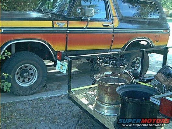 Side view of a 1979 Ford Bronco with orange and yellow stripes