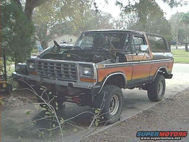 1978 Ford Bronco with hood open, parked on a driveway