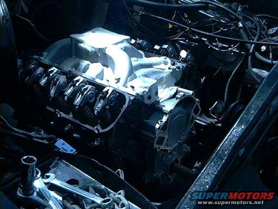 Engine with aluminum intake manifold and exposed valve train