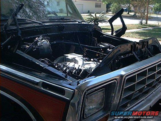 1978 Ford Bronco engine bay with hood open, showing engine and grille