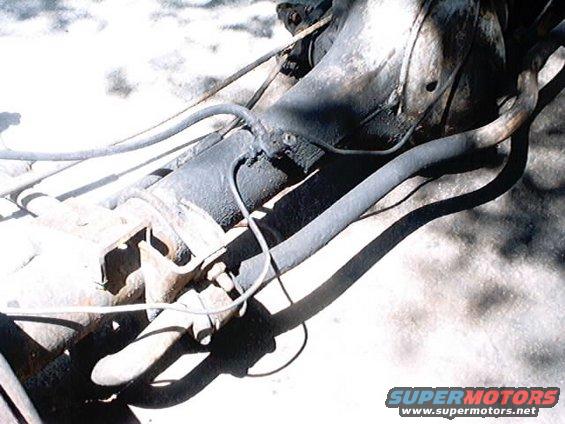 close-up of vehicle's rear axle and suspension parts