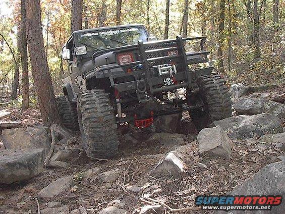 im000325.jpg Virgil just mows over this huge rock (look under his jeep).