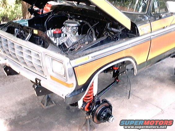 1979 Ford Bronco front end disassembled, hood open showing engine, front suspension removed