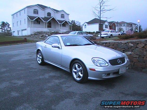 Silver convertible with a "SUPERMOTORS.NET" watermark