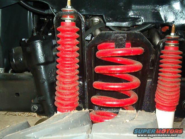 red coil spring and shock absorber with red bellows