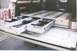 1990 Ford Bronco - The rear of a vehicle is outfitted with custom pull-out drawers for tool and supply organization.