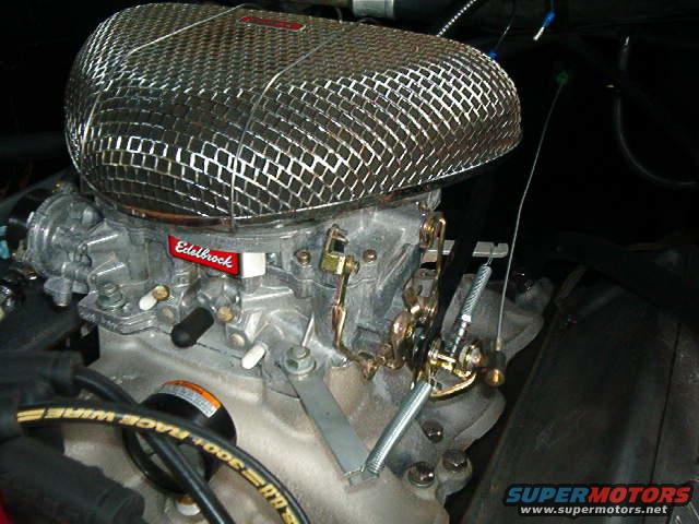 Edelbrock carburetor with chrome air cleaner and "Race Wire" spark plug wire