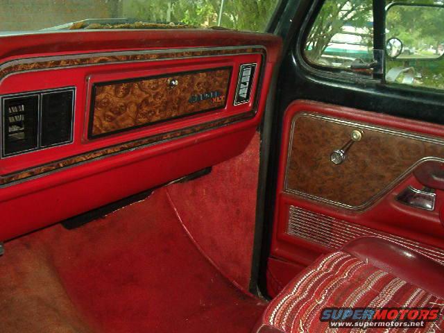 1979 Ford Bronco XLT interior with woodgrain trim on dashboard and door panel