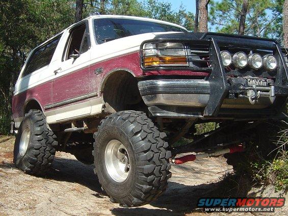 Lifted 1993 Ford Bronco with large tires and bull bar