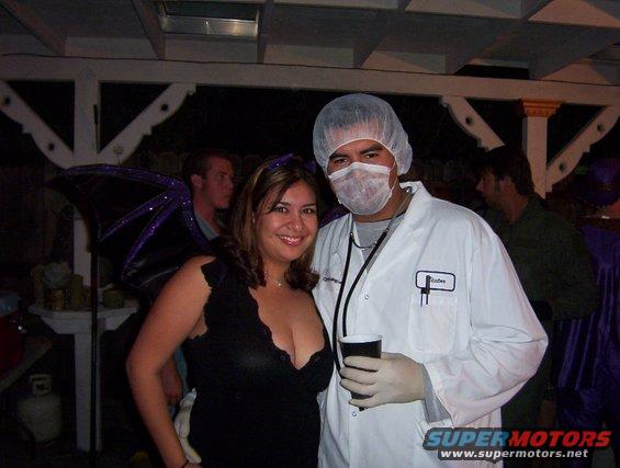 People in costumes at a party, one dressed as a doctor