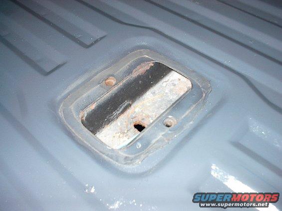 im002184.jpg Wish I could find this rubberized tape that surrounds the rear seat anchor plate so I could stick it between the taligate and tailgate access cover.