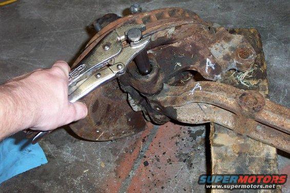 Stop 7--Use a hardened drift of some sort (this is a Chevy axle pin) and a heavy dead-blow hammer to drive the pin out.  It took over an hour to get this one out.