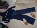 1993 Ford Probe - A sweatsuit and slippers are arranged on the floor next to a fish tank.