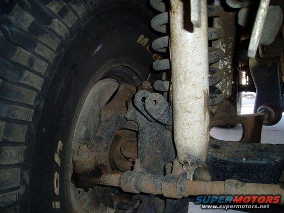 Close-up of vehicle suspension with tire and shock absorber