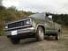 1983 Ford Ranger - This 1983 Ford Ranger pickup truck is parked on a dirt road with trees in the background.