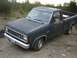 1983 Ford Ranger - This 1983 Ford Ranger pickup truck is seen from a 3q-front angle, parked outdoors on a dirt surface.