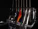 1990 Ford Bronco - A collection of electric guitars are organized and stored in a black case, ready for transport or use.