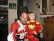 1986 Ford Bronco - A man and a child dressed in costumes pose for a photo inside a home.