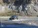 1992 Ford Bronco - Ford Bronco navigating a river crossing on a rocky terrain.
