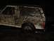 1989 Ford Bronco - Muddy 1989 Ford Bronco seen off-road at night.