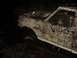 1989 Ford Bronco - Mud-covered 1989 Ford Bronco stuck in a muddy area at night.
