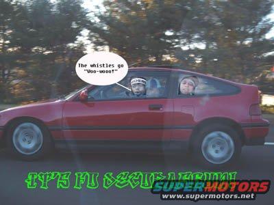 Red hatchback car in motion, side view. Two people visible inside. Text overlay reads 'IT'S FU SECURE MOTORS'