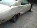 1971 Ford Torino - This silver car has significant body damage to the rear quarter panel and door, with a missing front fender and peeling vinyl top.