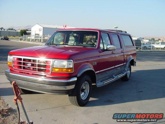 1994 Ford C-150 Centurion Conversions pickup truck, red exterior, parked outdoors