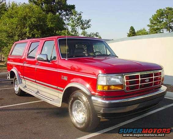 Red Ford Bronco SUV parked in a lot, front quarter view