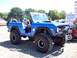 1974 Ford Bronco - This modified 1974 Ford Bronco features a lifted suspension and aggressive off-road tires, ready for any terrain.