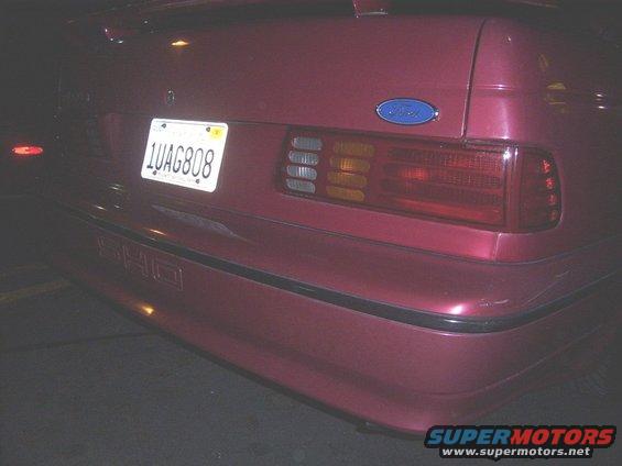 Red car rear with SHO badge and license plate 1UAG808