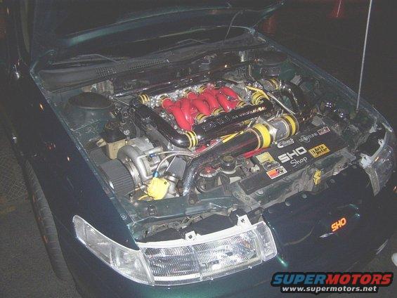 1998 Mercury Sable engine bay with turbocharger and red intake manifold