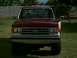1988 Ford Bronco - Front view of a red and white Ford truck, likely a 1987 model based on the grille design.